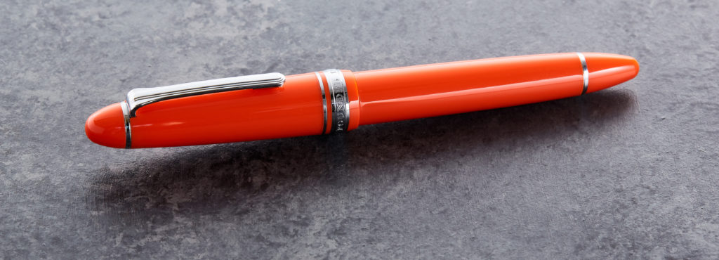 Sailor 1911L fountain pen capped sitting on a surface